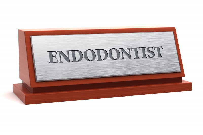 Nameplate with the word “endodontist” on it