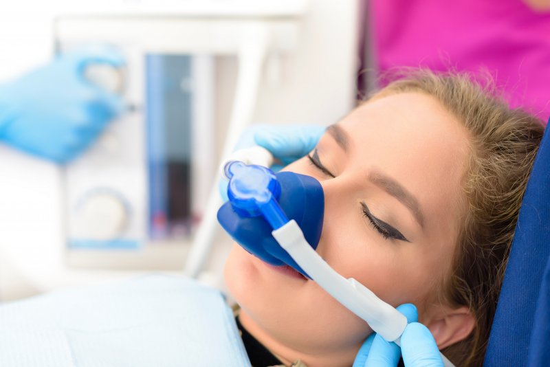 Patient with mask for dental sedation