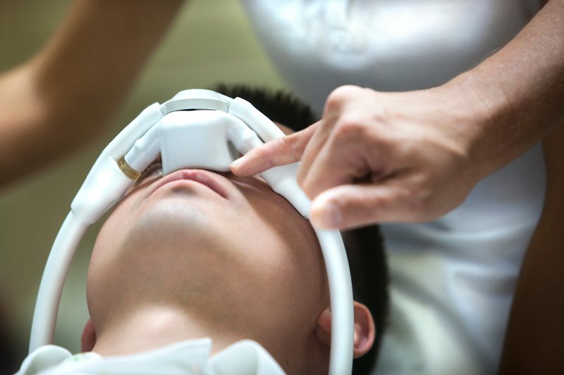 Patient relaxing in dental chair with nitrous oxide